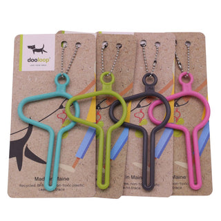 four dooloop dog waste bag holders on display cards