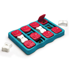 Teal Dog brick toy with red and white compartments for treats and slow eating