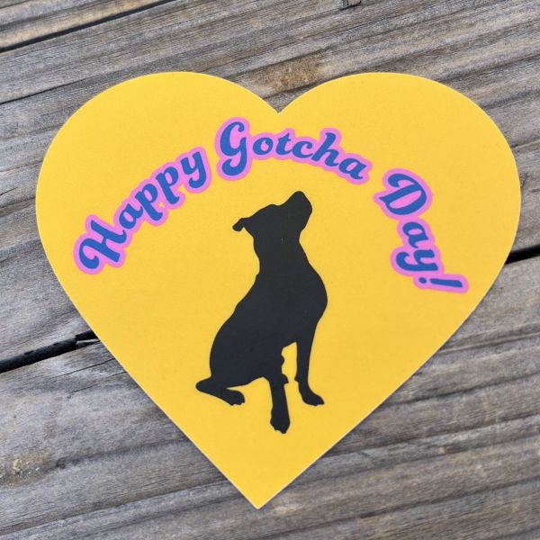 Yellow heart Happy Gotcha Day sticker w/ black dog on wood background
