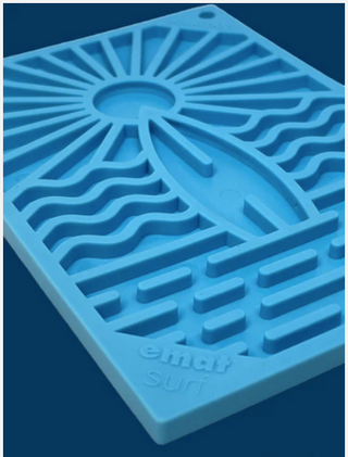 close up of blue surf's up design on the emat dog entrichment lick mat