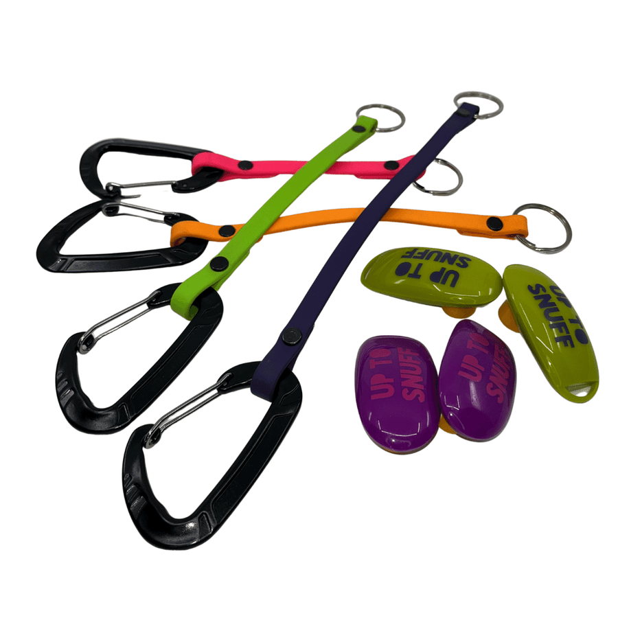 four different biothane clicker straps and 4 Up to Snuff clickers on a white background