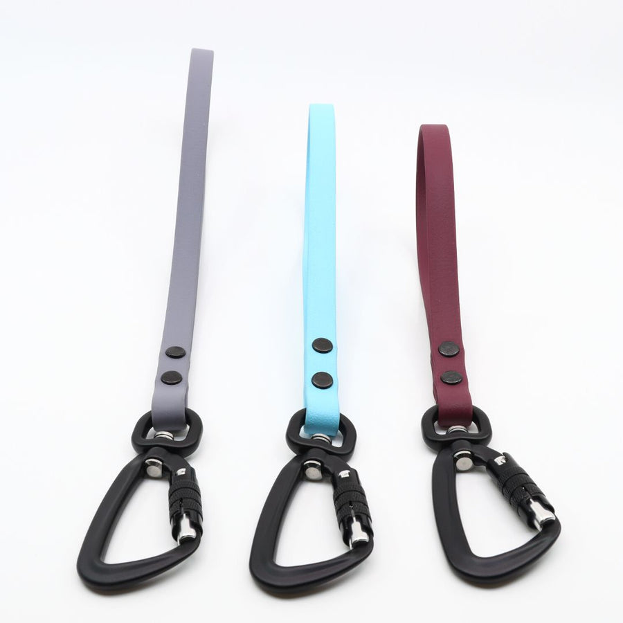 front view of three biothane sport traffic handles in granite, sky blue and plum
