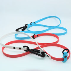 Biothane Trans Pride and Joy Leash in light blue, coral, and white with black sport hardware on a white background