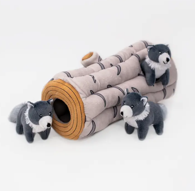 log burrow toy for dogs with three wolves