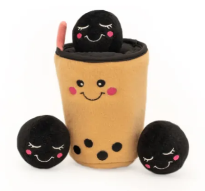 close up of plush burrowing dog toy with boba milk tea and three boba's