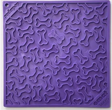purple dog enrichment lick mat with bones design