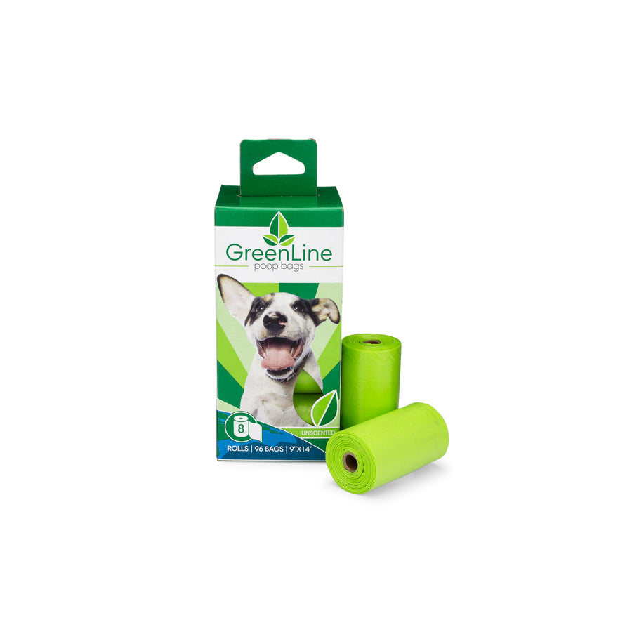 small green and white box from Greenline with white and black happy dog and two rolls of green poop bags next to the box