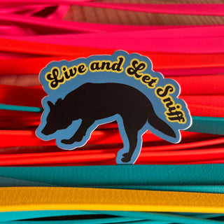 Blue sticker, with black dog shadow saying Live and Let Sniff