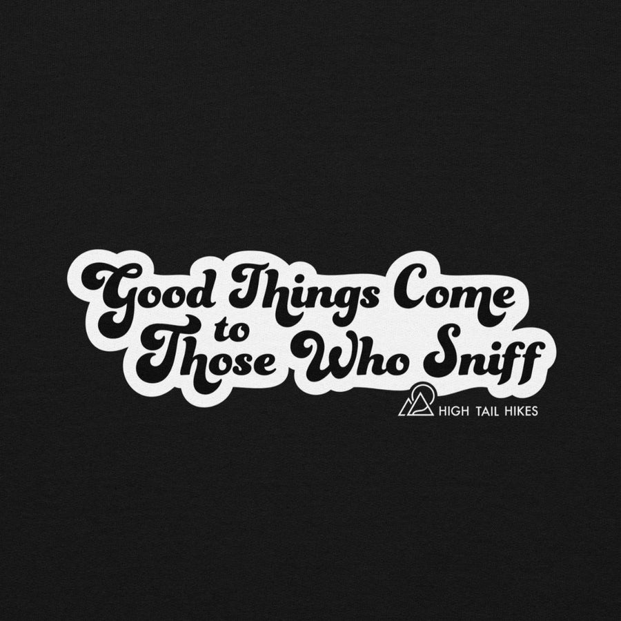 close up of back of black hoodie showing "Good Things Come to Those Who Sniff" with a white outline and small white High Tail Hikes logo on the right bottom coroner