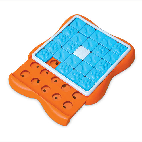 a plastic dog puzzle toy with sliding treat compartments that is orange, blue, and white with the tray open