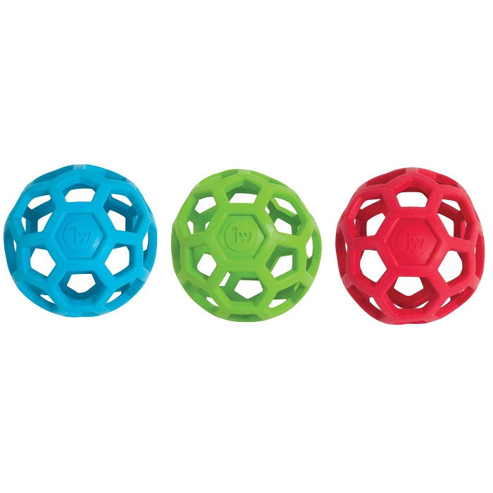 Blue, green and red rubber treat ball dispenser on white background