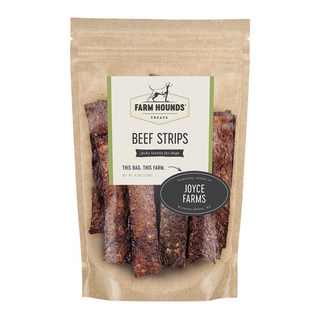white background, tan package with jerky looking meat strips for dogs behind a clear cover, off white label that reads "Farm Hounds Treats, Beef Strips, Humanly raised by Joyce Farms"