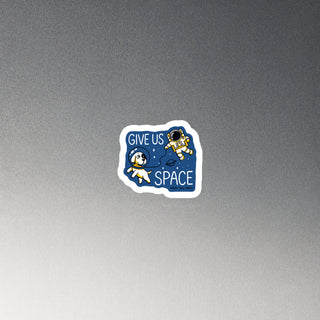 cut out magnet in blue, with dog and astronaut reading "Give Us Space"