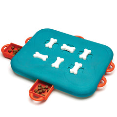 Nina Ottosson Dog Casino Toy with sliding compartments for treats in orange, teal and white