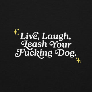 close up of back of black hoodie with white letters that read "Live, Laugh, Leash Your F Dog"
