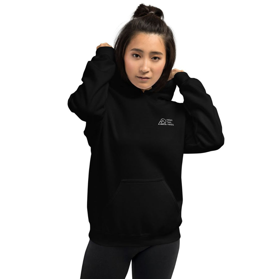 Woman facing forwards, wearing black hoodie - left front reads "High Tail Hikes logo"
