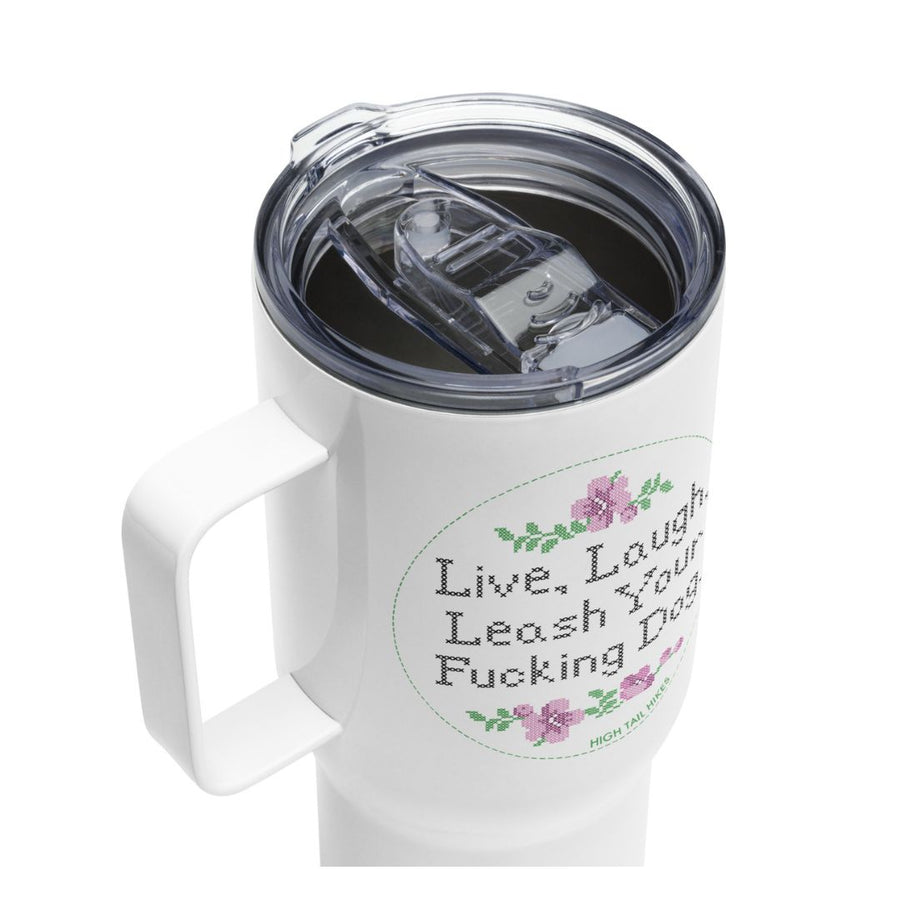 top view of white travel mug to show the type of lid, handle and reads "live, Laugh, Leash Your F Dog"
