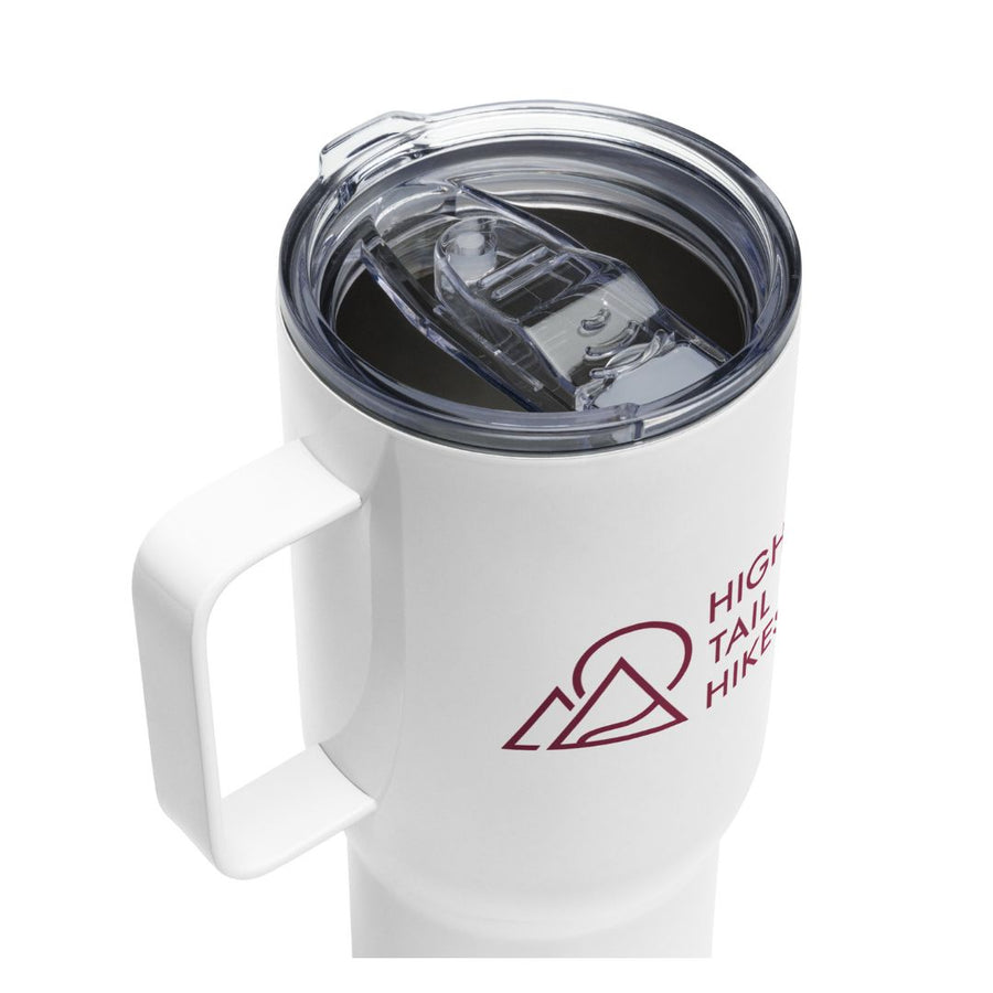 top view of white travel mug, handle to the left, red high tail hikes logo