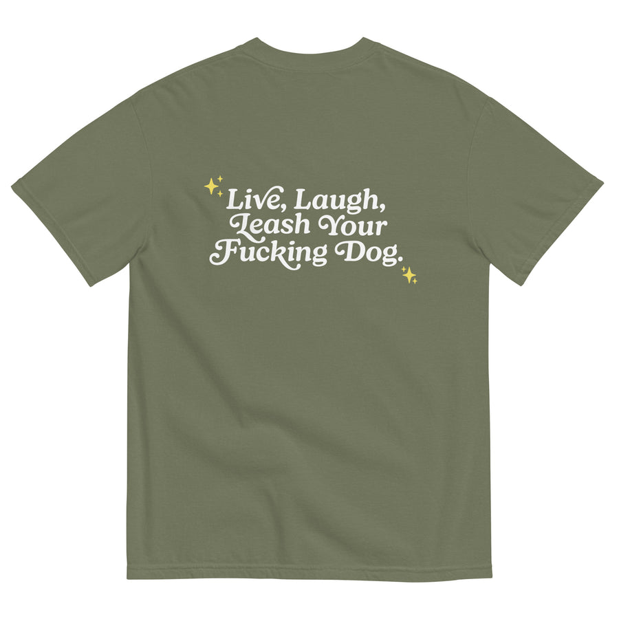 back of olive green unisex t-shirt that reads "Live, Laugh, Leash Your F Dog" in white letters and gold stars in the coroners