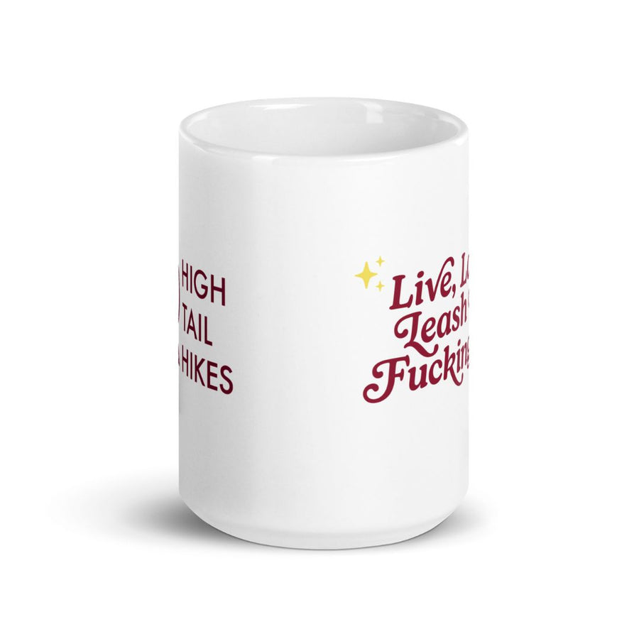 side view of 15 oz white ceramic mug showing logo on left and live laugh leash on the right