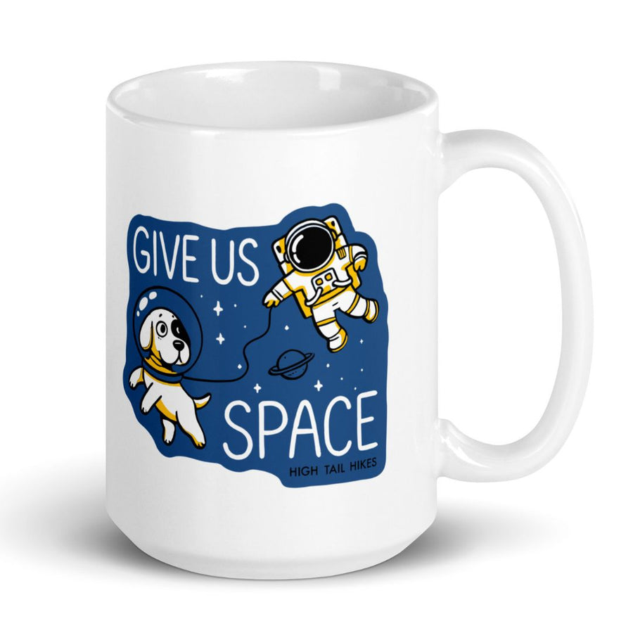 15 oz white ceramic mug that has a blue graphic of a dog and astronaut in space that reads "Give Us SPace"