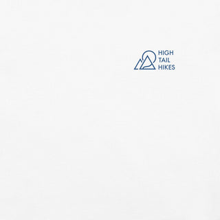 close up of front of white unisex tee with blue high tail hikes logo on the left chest area
