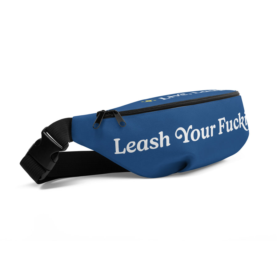 side view of blue fanny pack that reads "Leash Your F Dog" in white letters