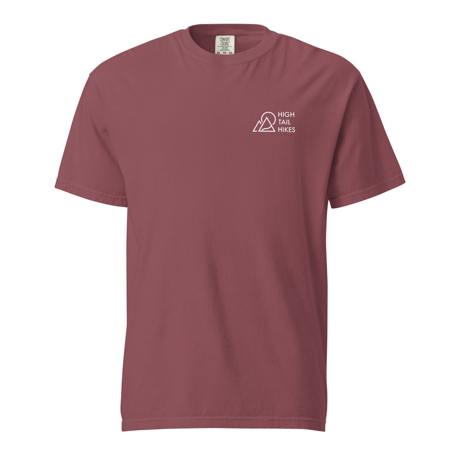 front of brick colored unisex t-shirt that has a white high tail hikes logo in the front left chest area
