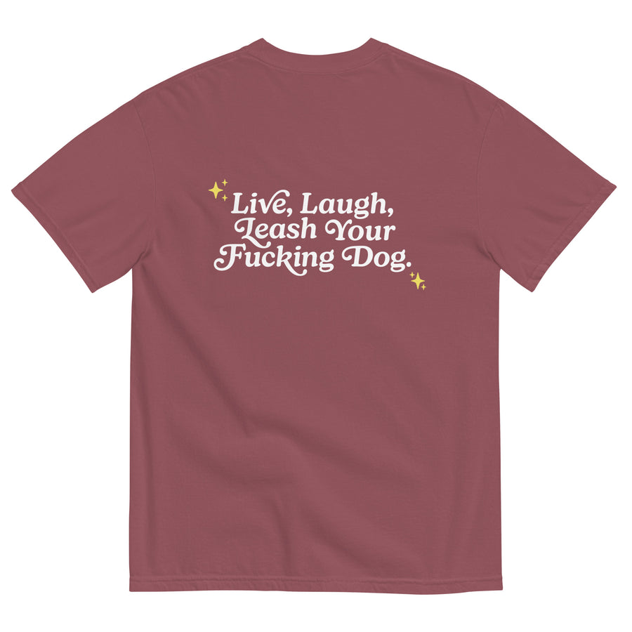 back of brick colored unisex t-shirt that reads "Live, Laugh, Leash Your F Dog" in white letters and gold stars in the coroners