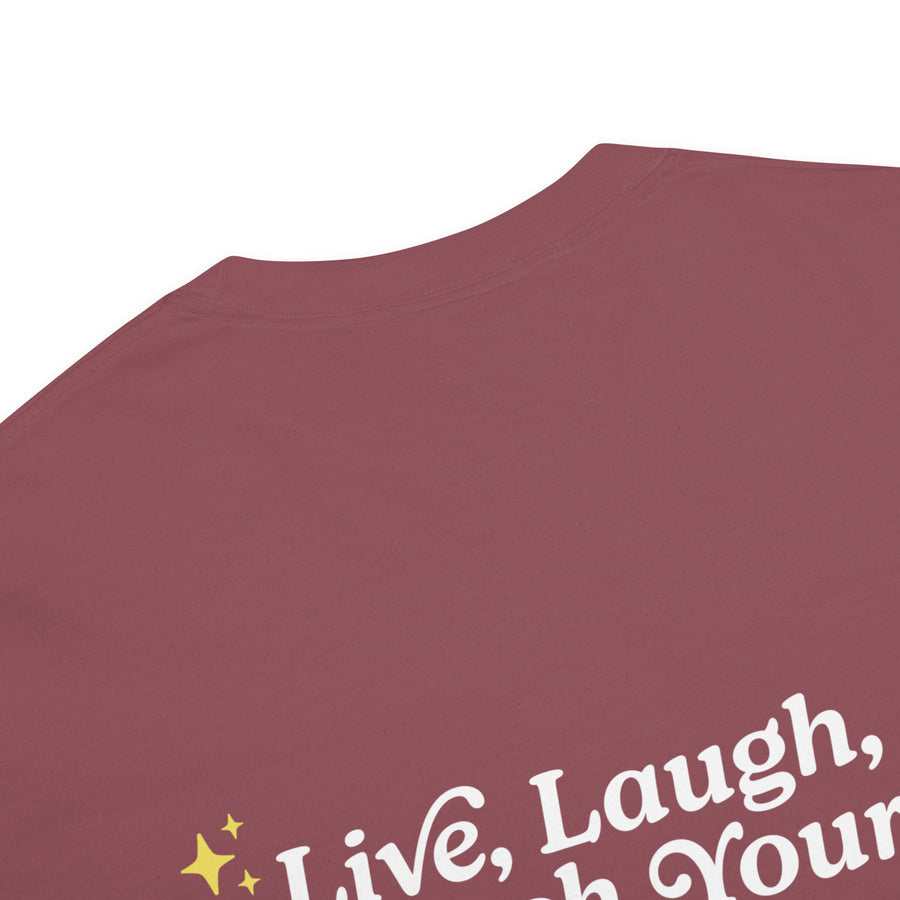 close up of back of brick colored unisex t-shirt that reads "Live, Laugh, Leash Your F Dog" in white letters and gold stars in the coroners