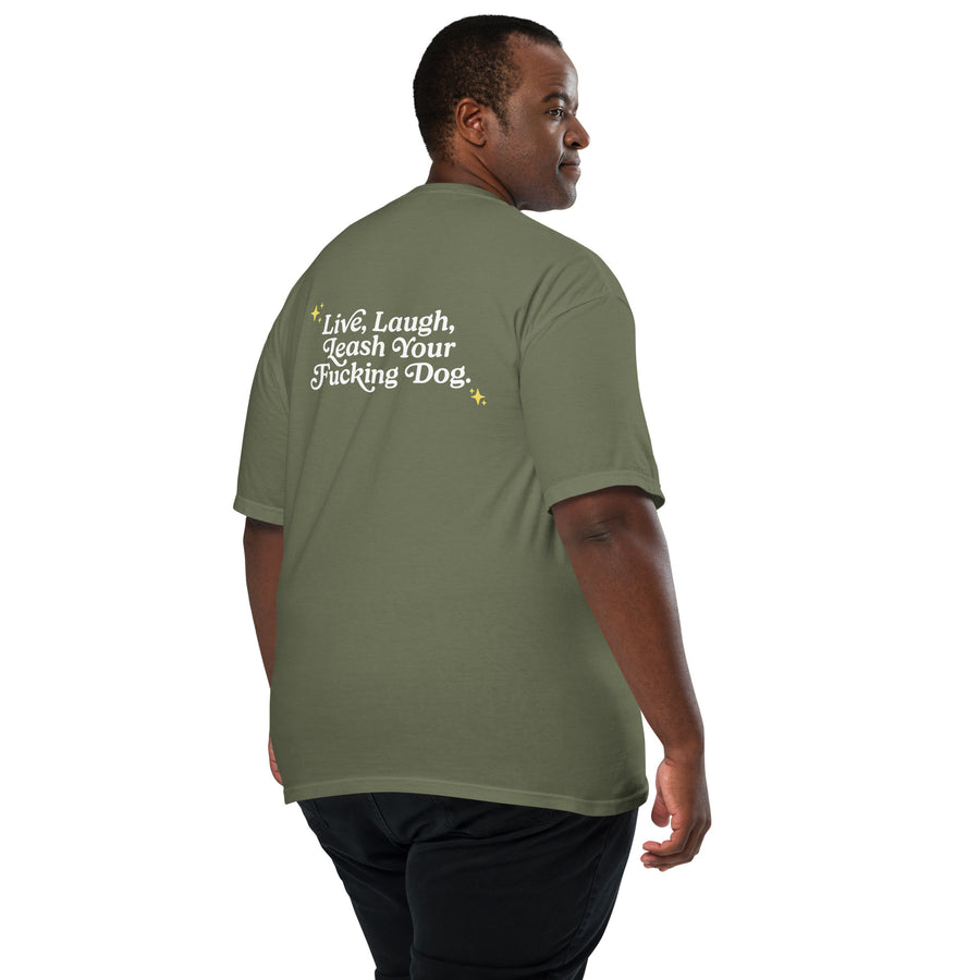 large male person showing the back of unisex olive green t-shirt that reads "Live, Laugh, Leash Your F Dog" in white letters and gold stars in the coroners