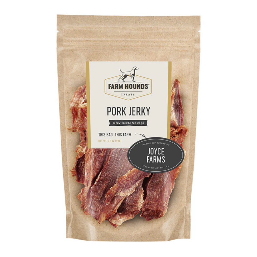 white background, tan package with jerky looking meat strips for dogs behind a clear cover, off white label that reads "Farm Hounds Treats, Pork Jerky, Humanly raised by Joyce Farms"