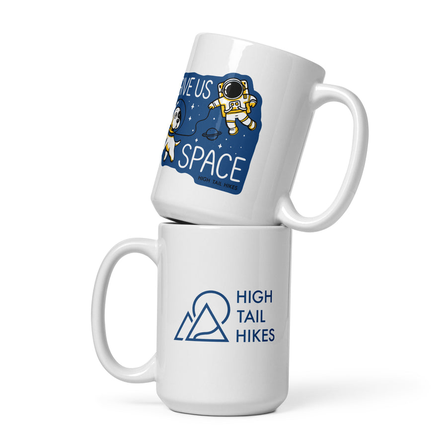 two white ceramic 15 oz mugs stacked - top mug shows a picture of space an astronaut that reads "Give Us Space" while the bottom mug has a blue High Tail Hikes logo