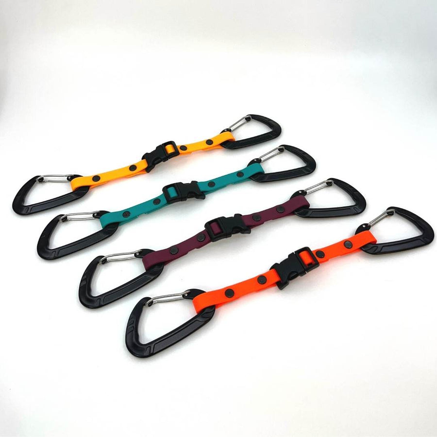four different colored biothane waist to leash straps with sport hardware on a white background