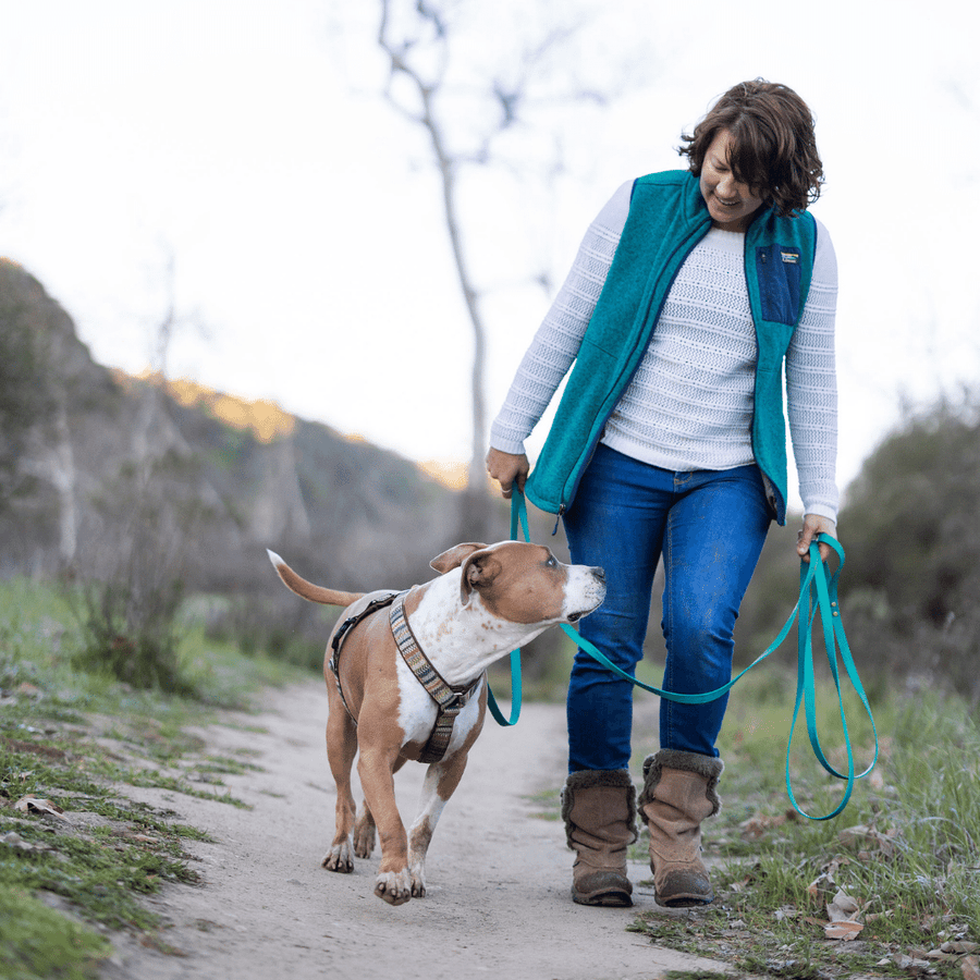 women walking with dog using the long dog leash made of biothane