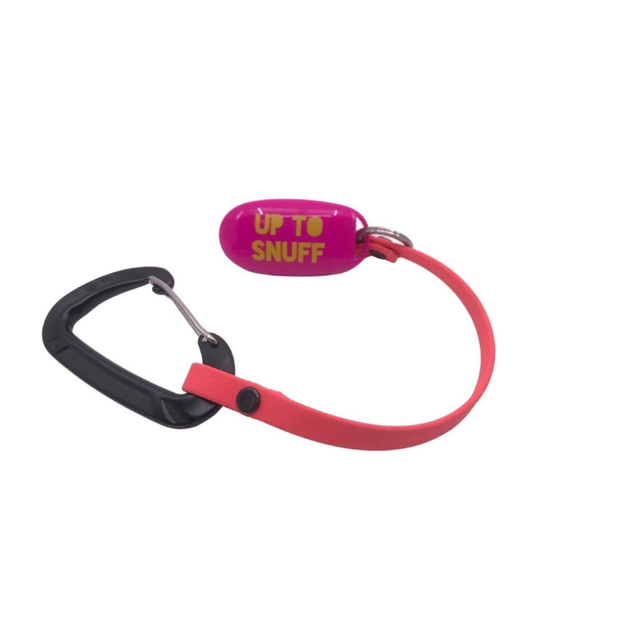 up to snuff clicker in pink attached to a red leash extender with sport hardware