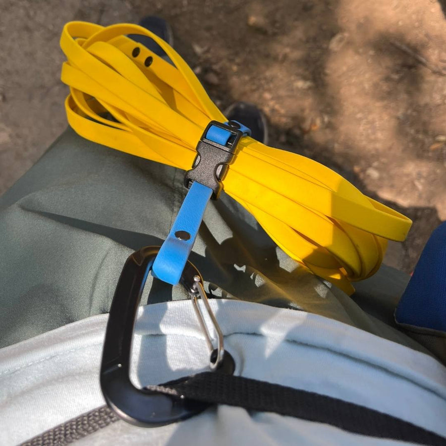 close up of the biothane quick release long line keeper attached to persons belt