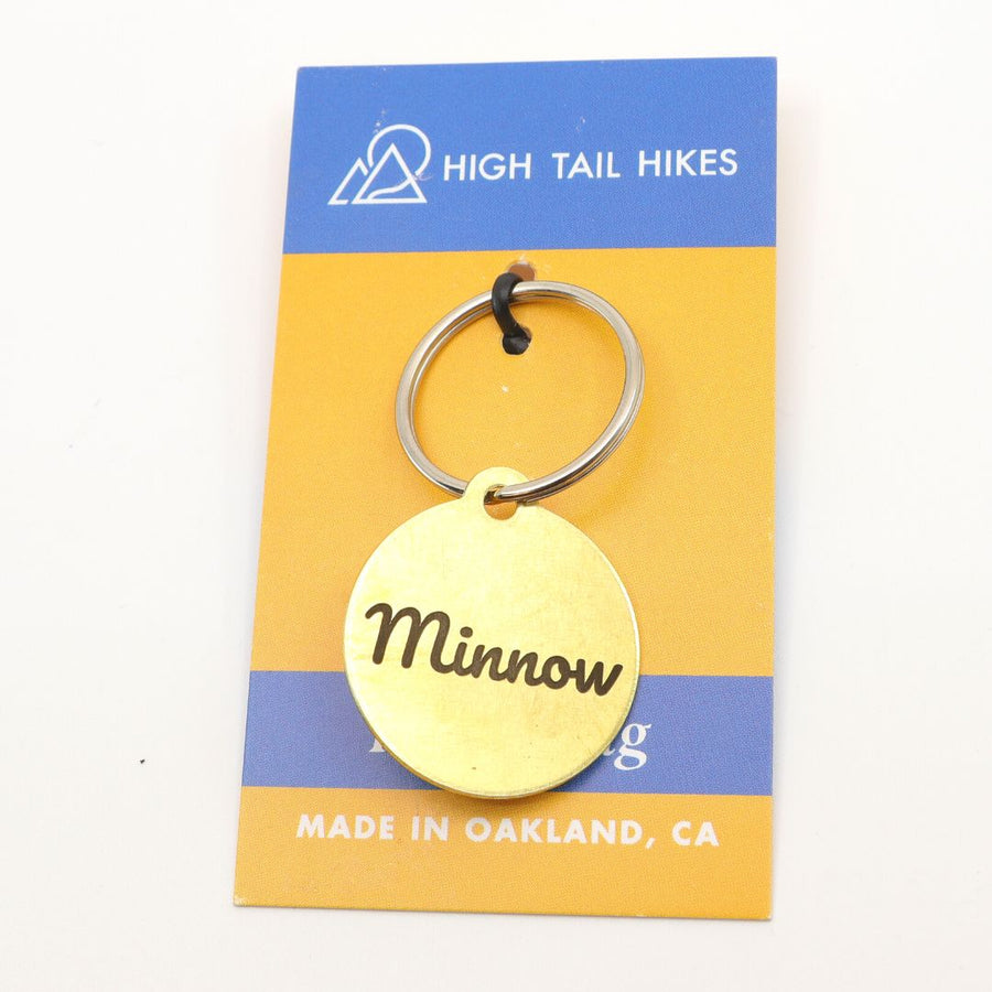 Classic dog ID tag in brass on High Tail Hikes logoed display card