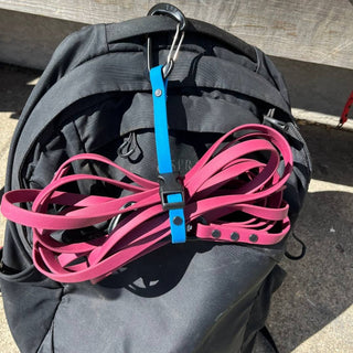 close up of biothane quick release long line keeper attached to a belt