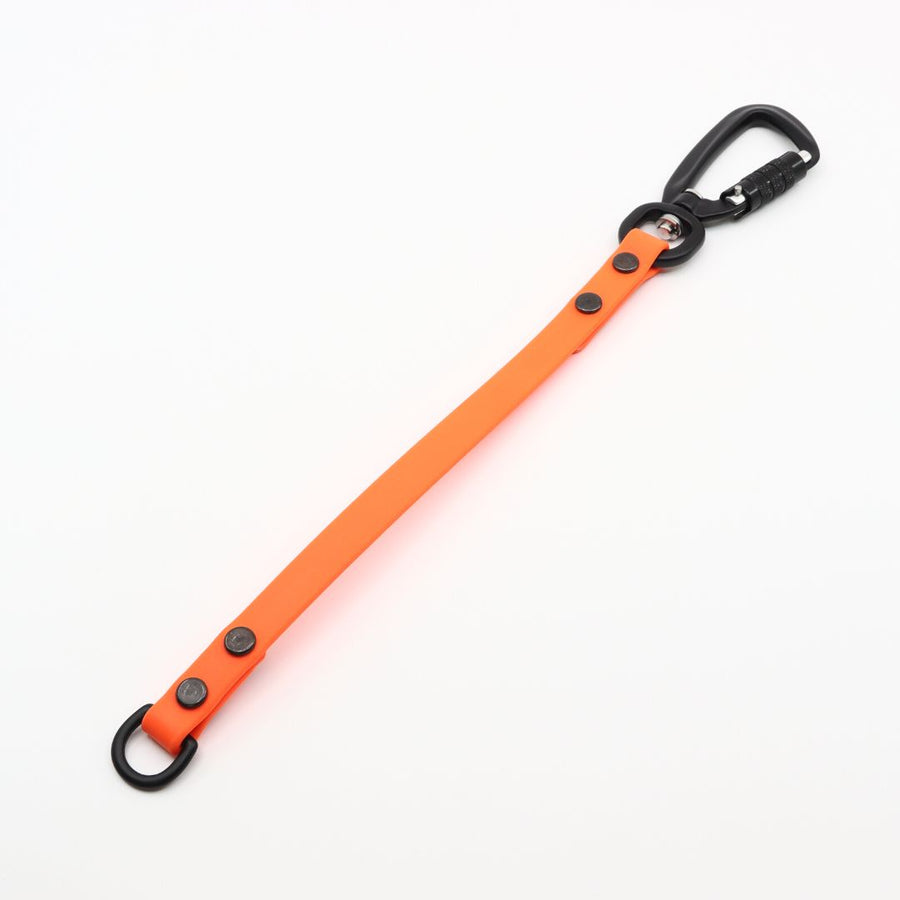 orange colored biothane leash extender with black sport hardware on a white background