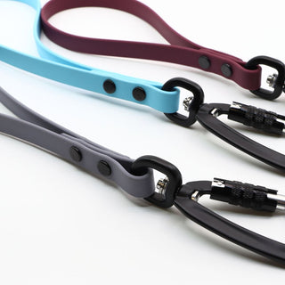 close up of biothane sport traffic handles in granite, sky blue and plum