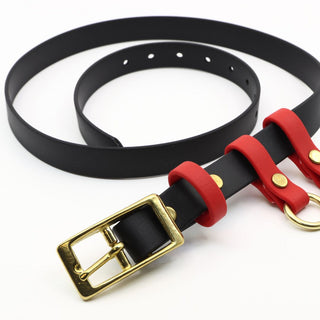 close up of black biothane utility belt with red accents