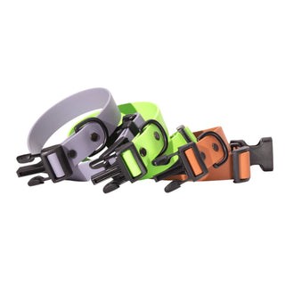 graphite, green and poppy biothane dog collars coiled together on white background